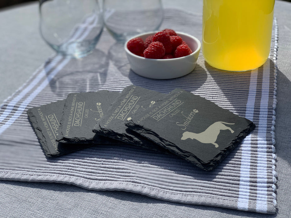 A house is not a home without a dog called ... personalised slate coasters